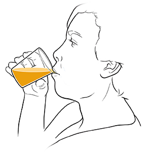 Woman drinking fruit juice from cup.